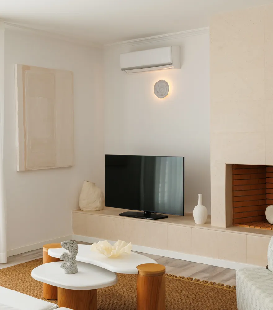 Living room with fireplace and armchair