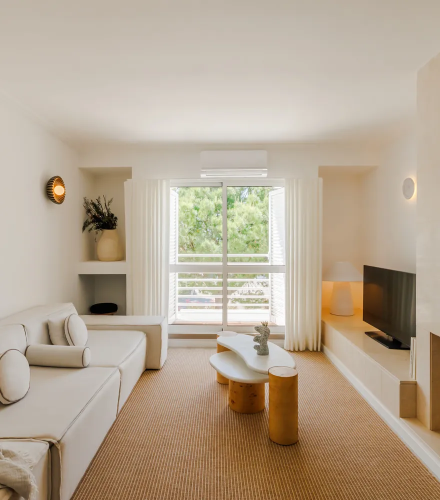 Living room with fireplace and open shutters