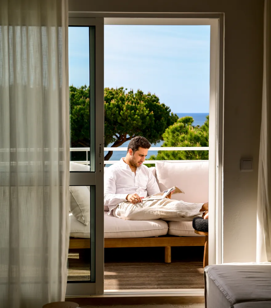 Guest reading on the apartment terrace