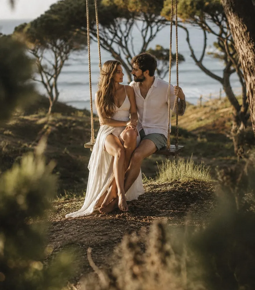 A couple on the swing above the Atlantic
